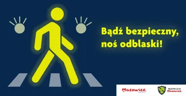 Grafika informacyjna z żółtą sylwetką pieszego na przejściu dla pieszych, hasłem o noszeniu odblasków oraz logotypami Mazowsze i Bezpieczne Mazowsze.
